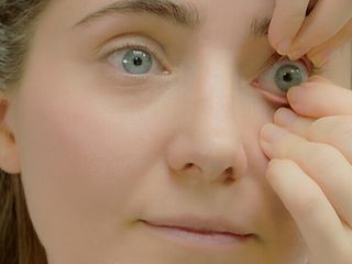 3. Gently pinch the contact lens off